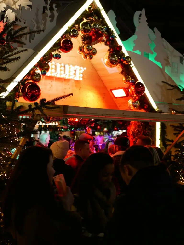 Christmas Market in Germany with festive lights and wooden stalls